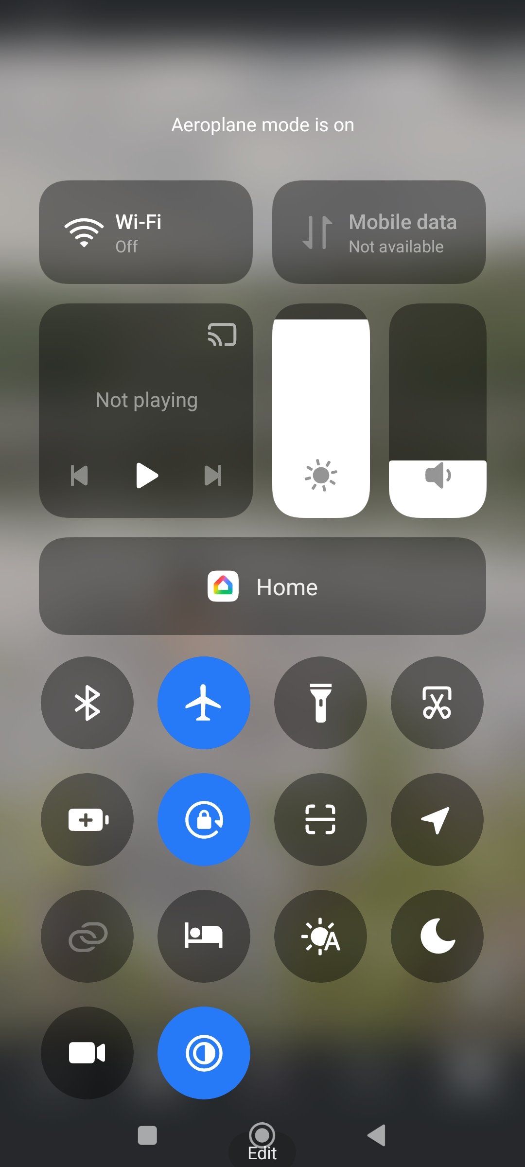 Phone control center showing Airplane Mode and Do Not Disturb-related toggles